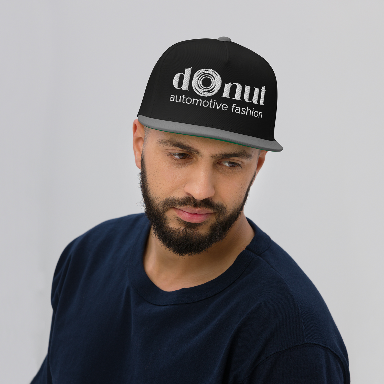 Flat bill snapback hat with embroidered logo