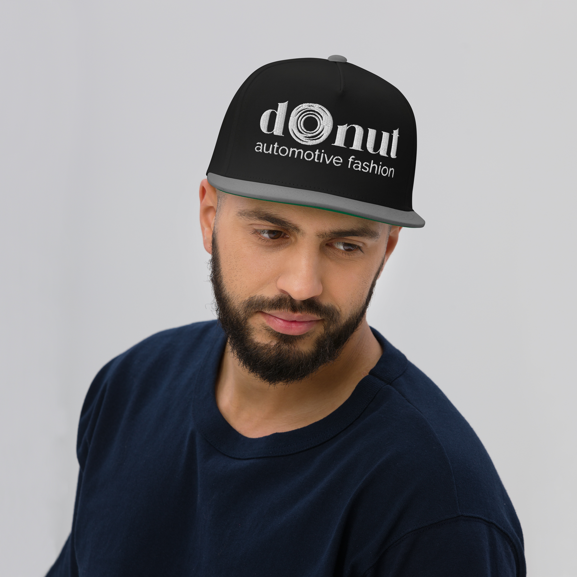 Flat bill snapback hat with embroidered logo